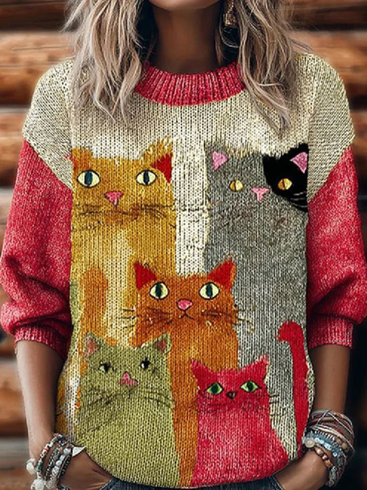 Le chat des femmes a tricoté le chandail